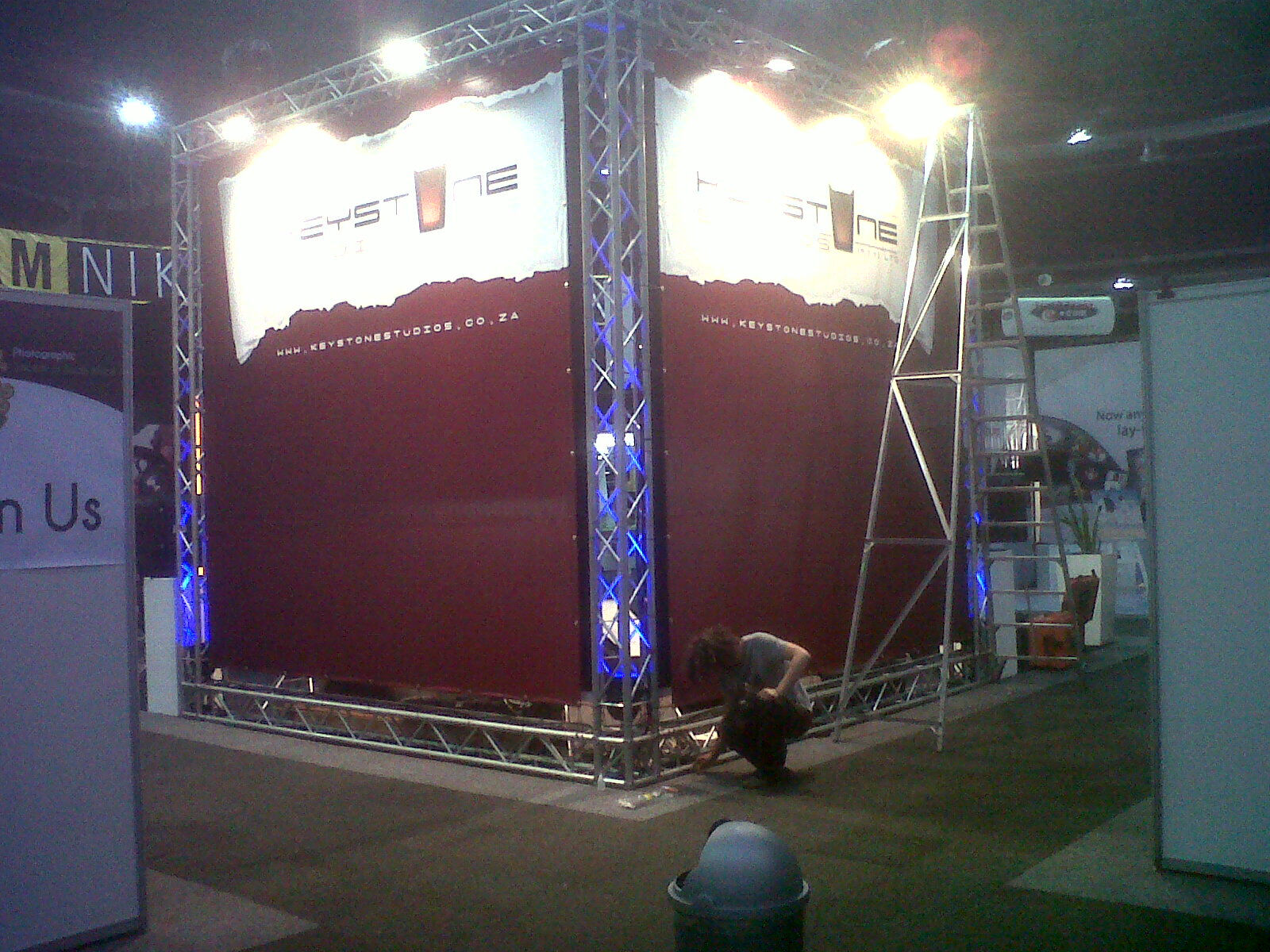 Printed Keystone Studios exhibition stand banners on a truss expo structure