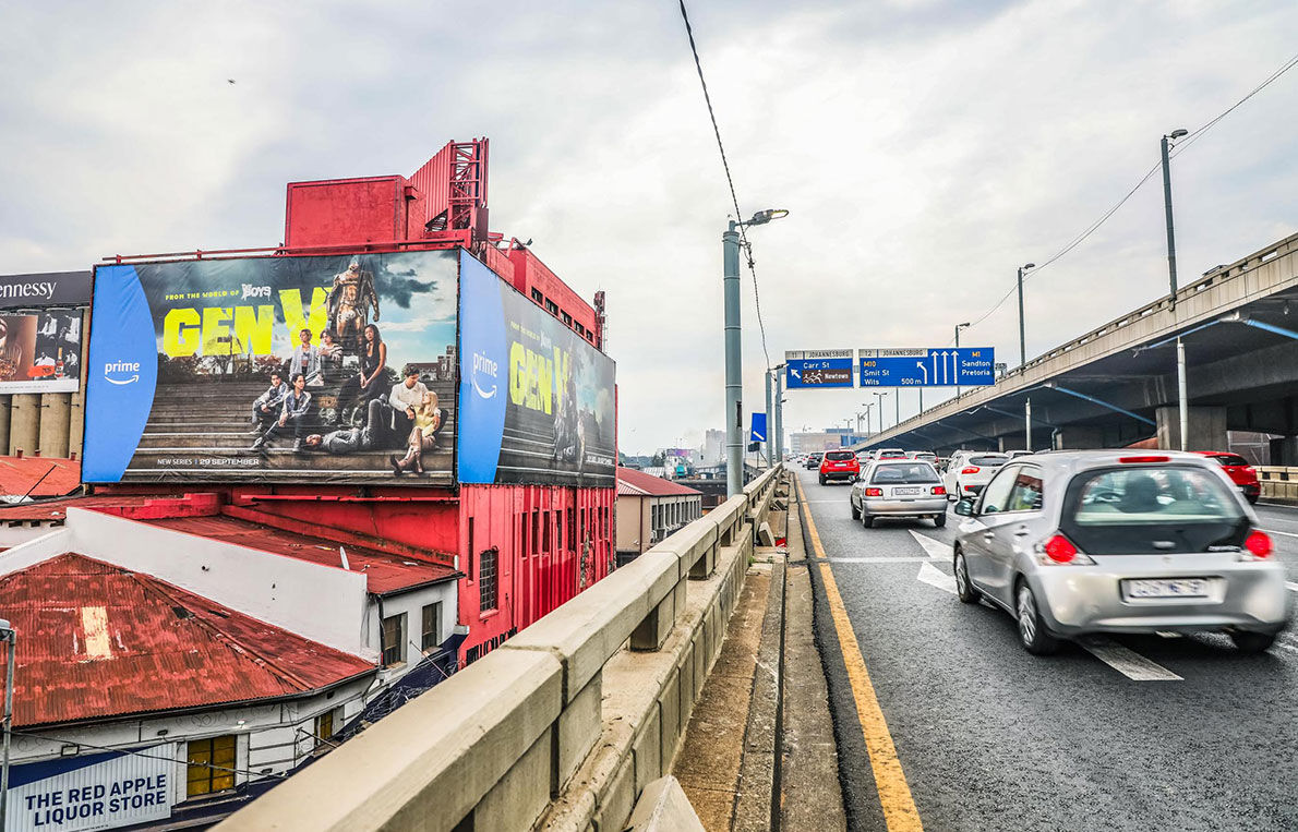 Gen V billboard printed on PVC above a busy city freeway